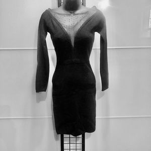 Black dress with lace around the neck and chest